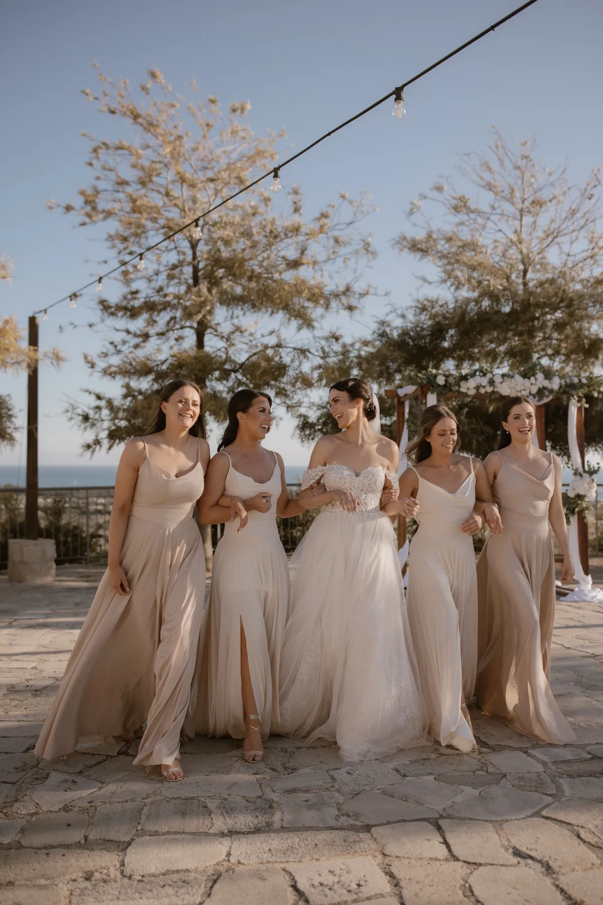 Group of Bridesmaids locked in arms